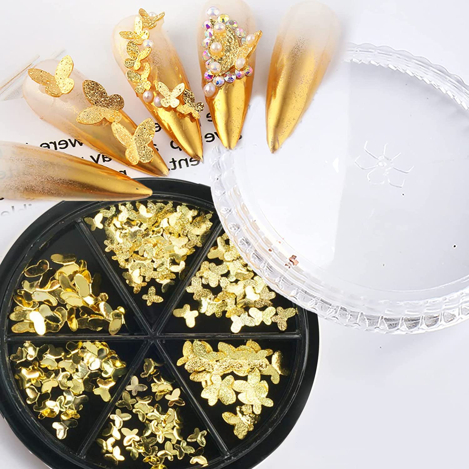 Assorted sizes of 3D metallic alloy butterfly nail studs showing smooth and textured gold surfaces.
