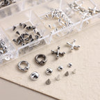 Round steel balls and flat back metal beads in mixed sizes.