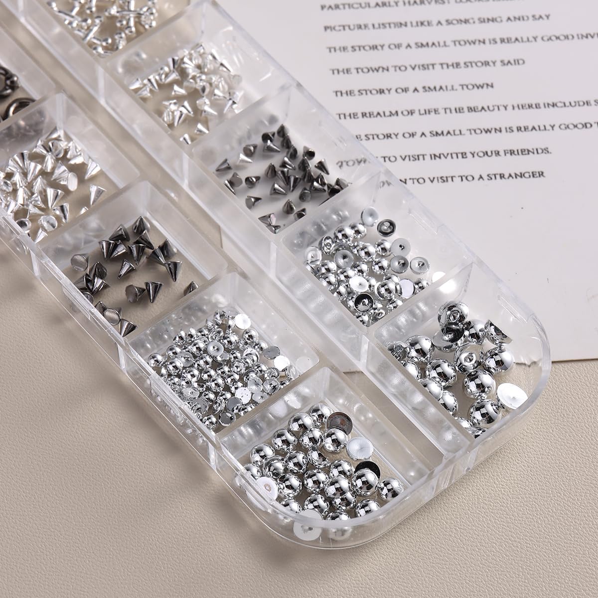 Top view of nail art charms organized in storage boxes