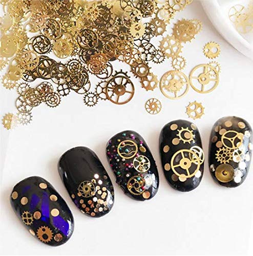 Close up shot of various ultra thin alloy metal steampunk clockwork gear pieces for salon manicure detailing