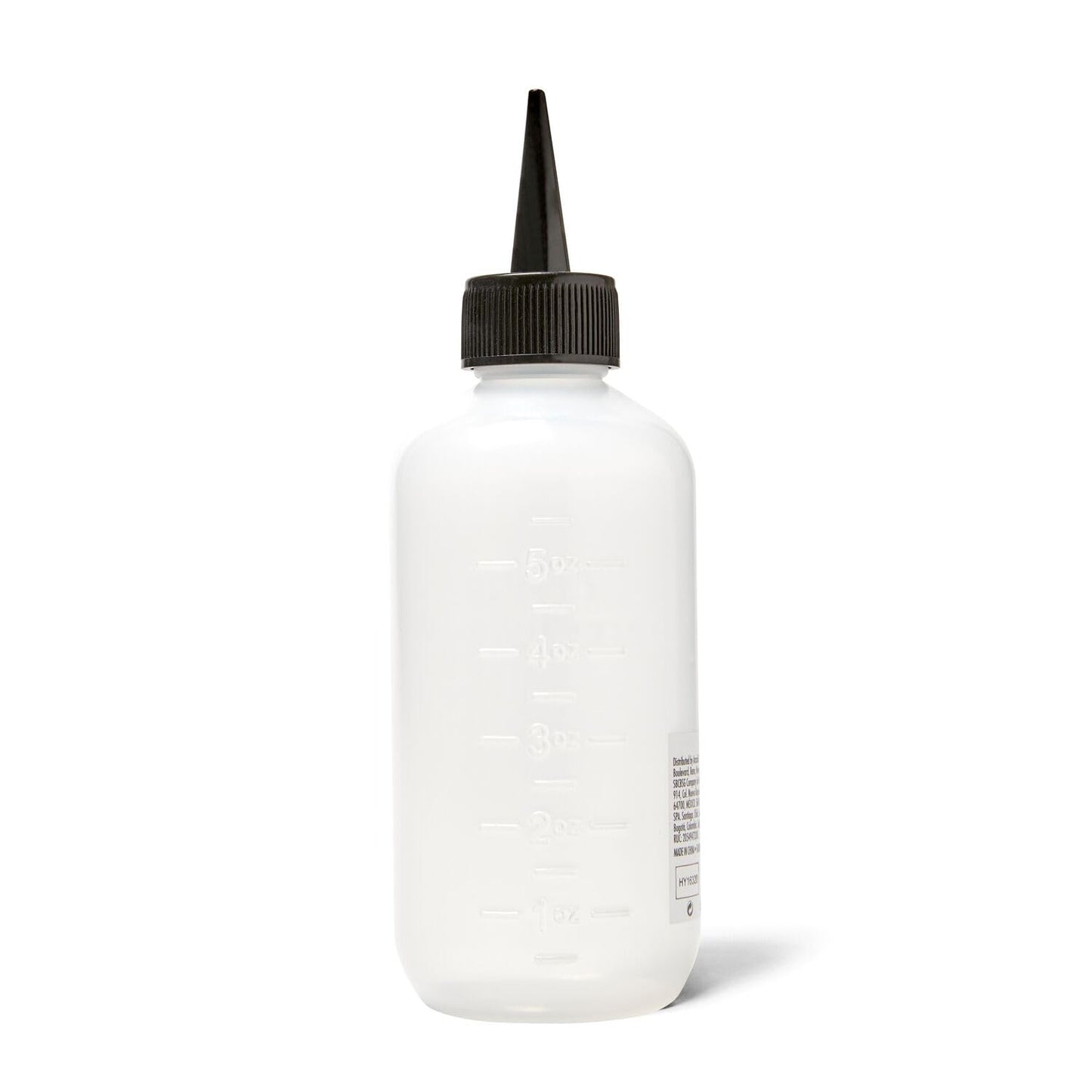 Salon Care applicator bottle being used for hair root treatment