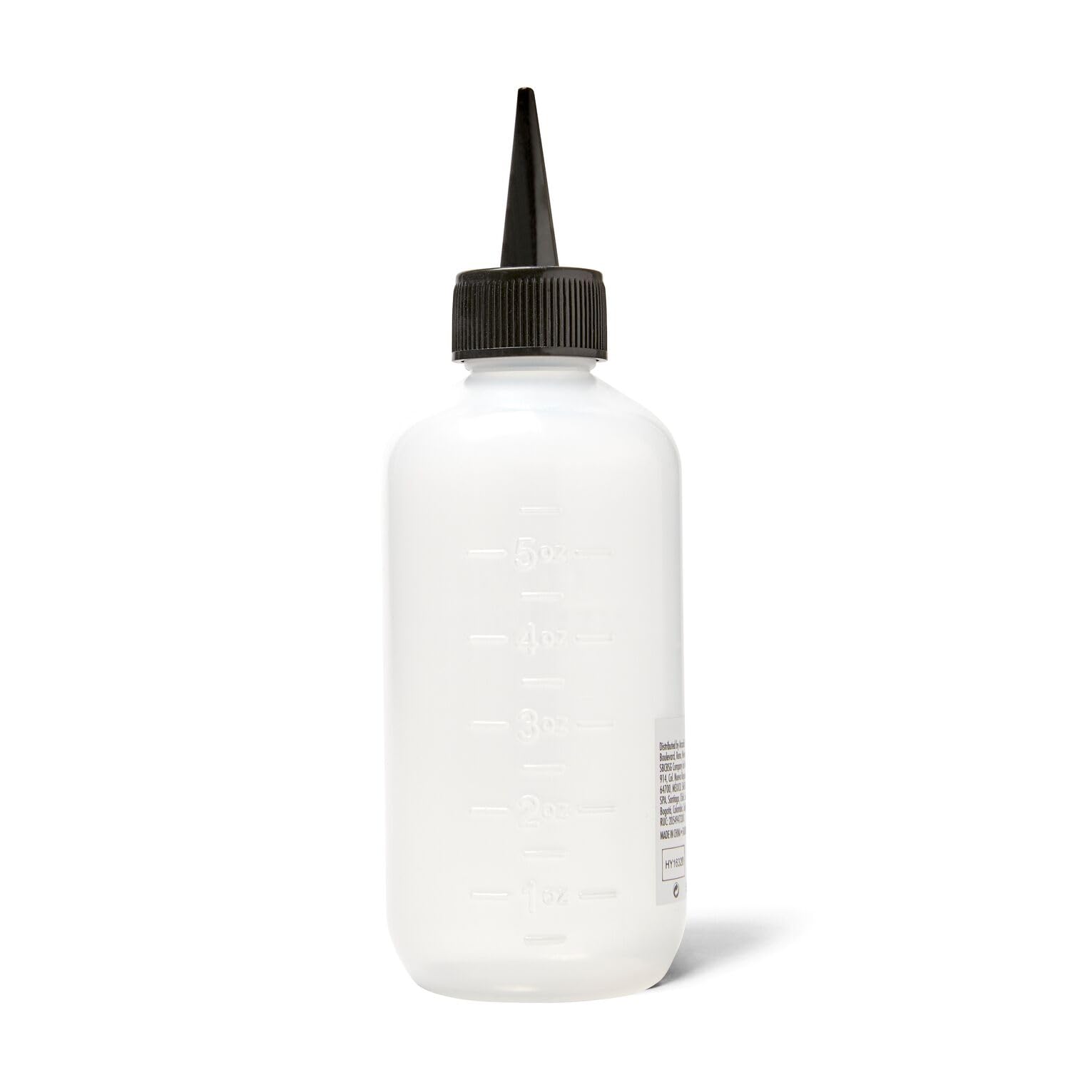 Salon Care applicator bottle being used for hair root treatment