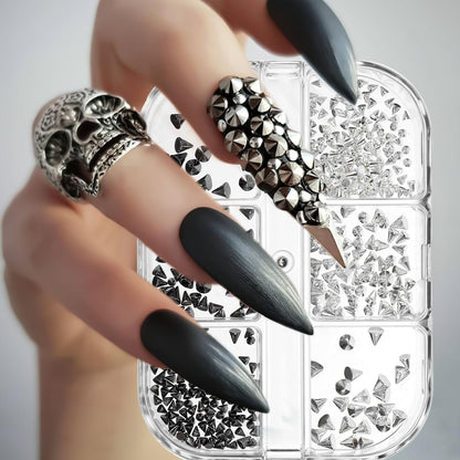 Close up of silver and black cone spikes for nail art