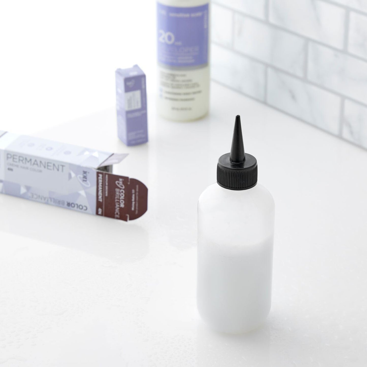Top view of Salon Care narrow tip nozzle and cap