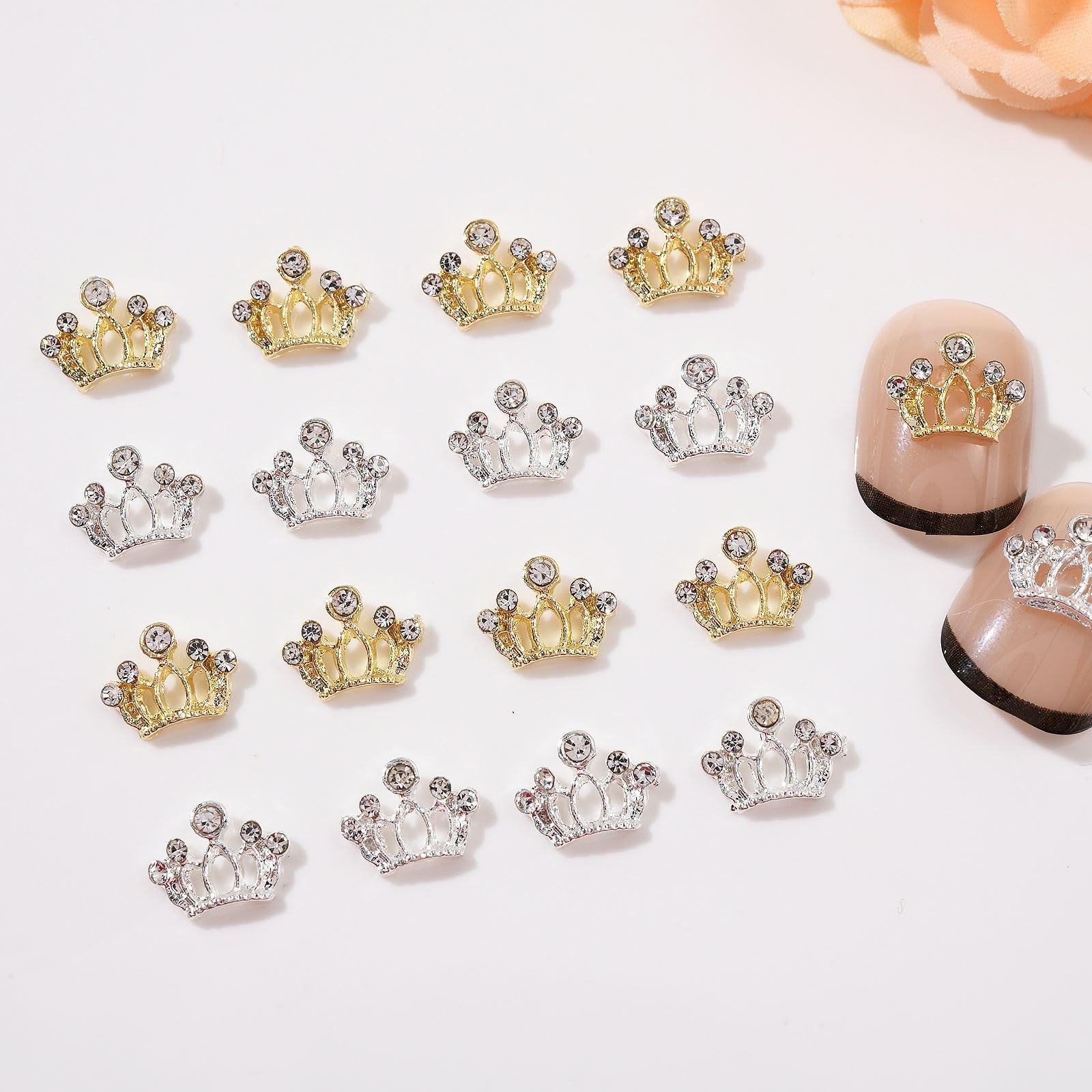 Arrangement of miniature 3D alloy bow tie nail accessories on a professional salon background.