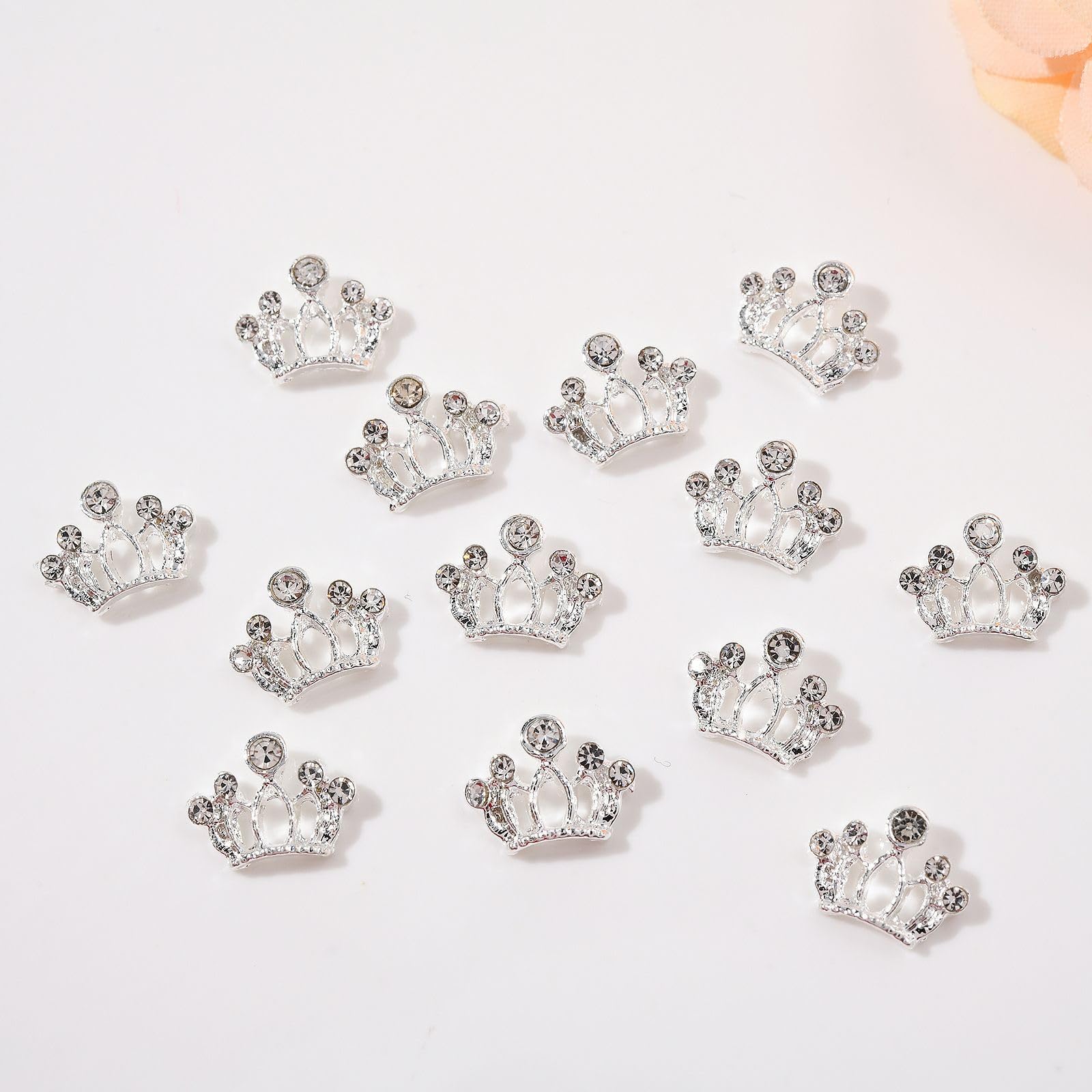 Detailed texture view of Sevgob metal bow charms showing the shiny crystal details.
