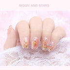 Completed manicure design featuring Wokoto gold and silver studs