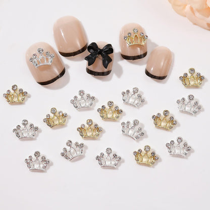 Flatback alloy bow charms being applied with tweezers onto a fresh gel manicure.