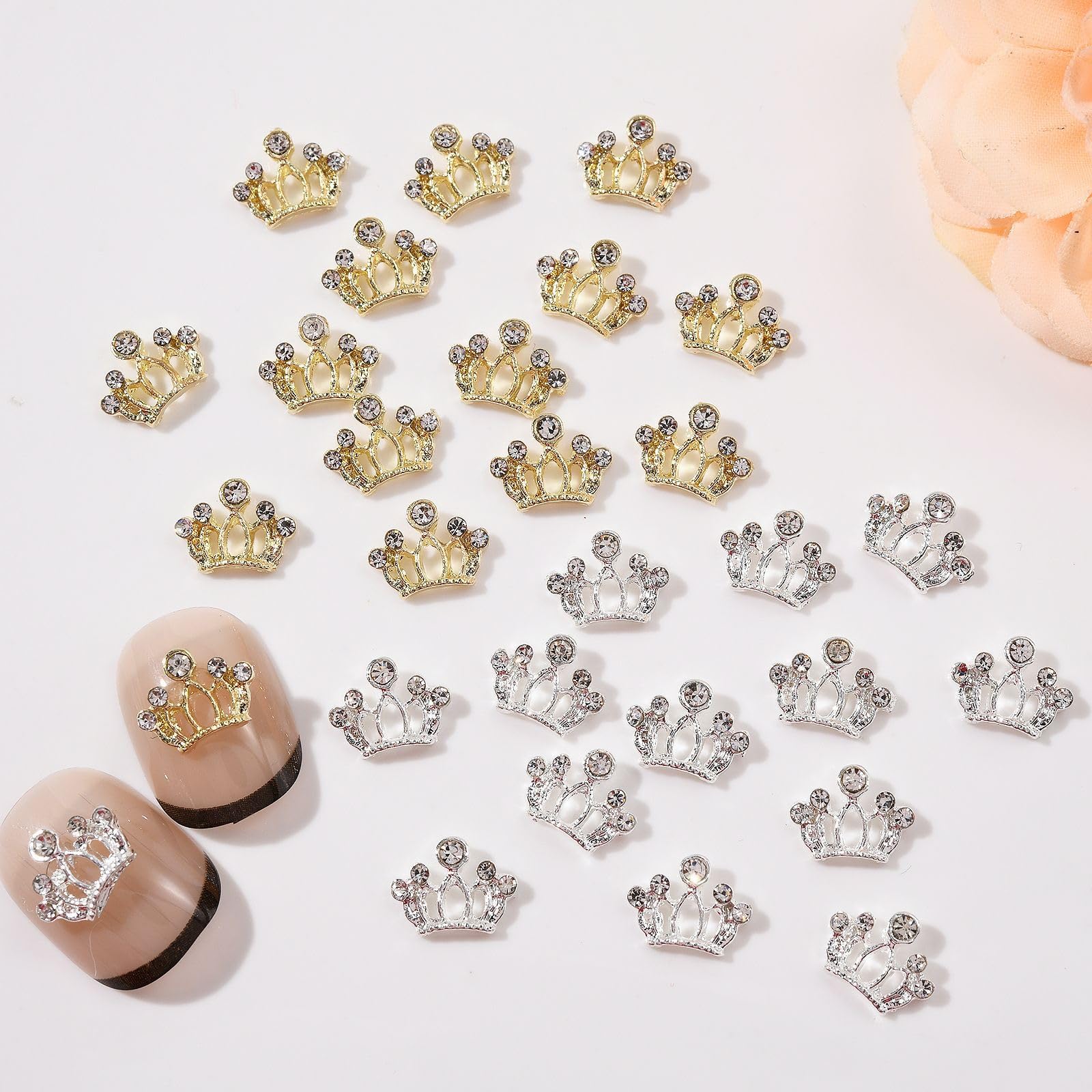 Assorted collection of gold silver and gray metallic bow nail jewels for professional nail art.