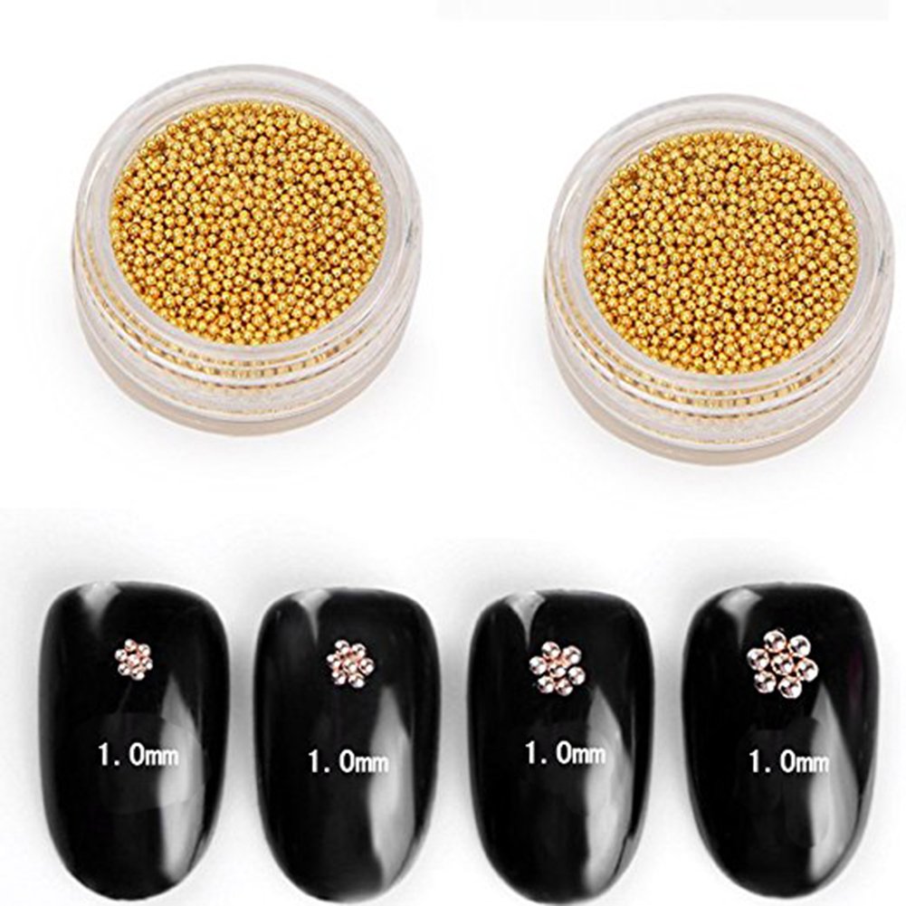 Close up view of 1 millimeter gold steel ball mini beads for textured manicure styling.