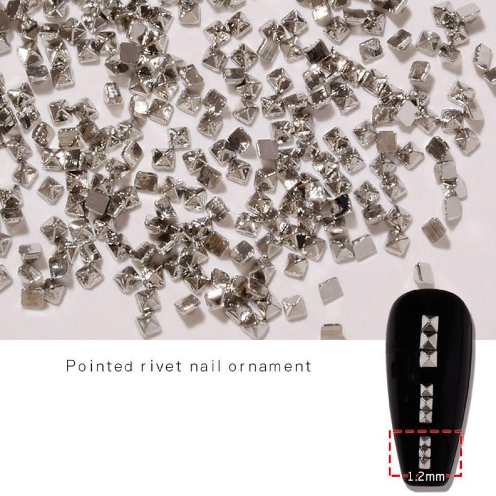 Detailed product shot of durable alloy metal nail embellishments showing their glossy silver shine.