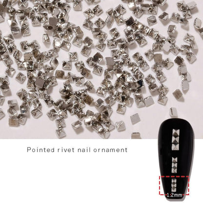 Detailed product shot of durable alloy metal nail embellishments showing their glossy silver shine.