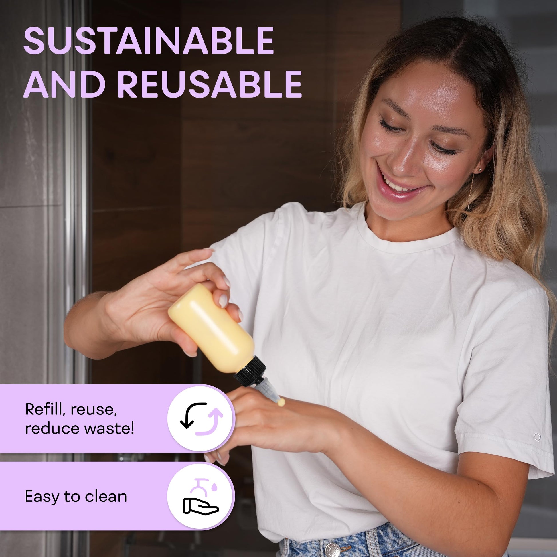 Side view of two clear four ounce refillable plastic bottles with black caps