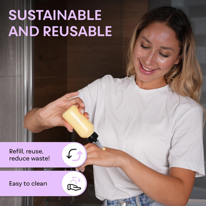 Side view of two clear four ounce refillable plastic bottles with black caps