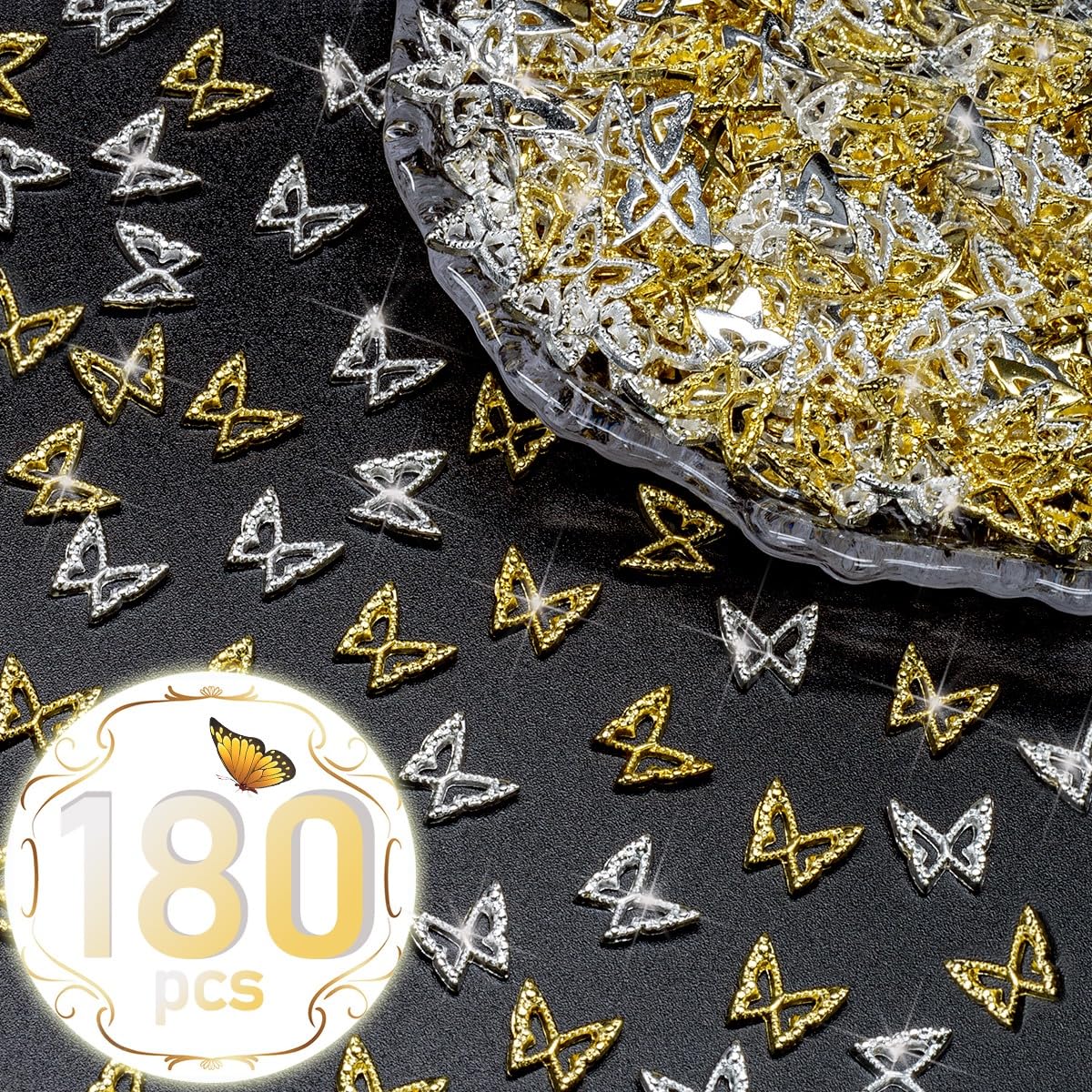 Close up view of golden butterfly alloy studs arranged neatly on an acrylic nail extension to showcase the intricate hollow out design.