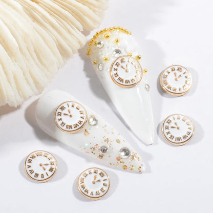 Close up of retro white clock nail art studs