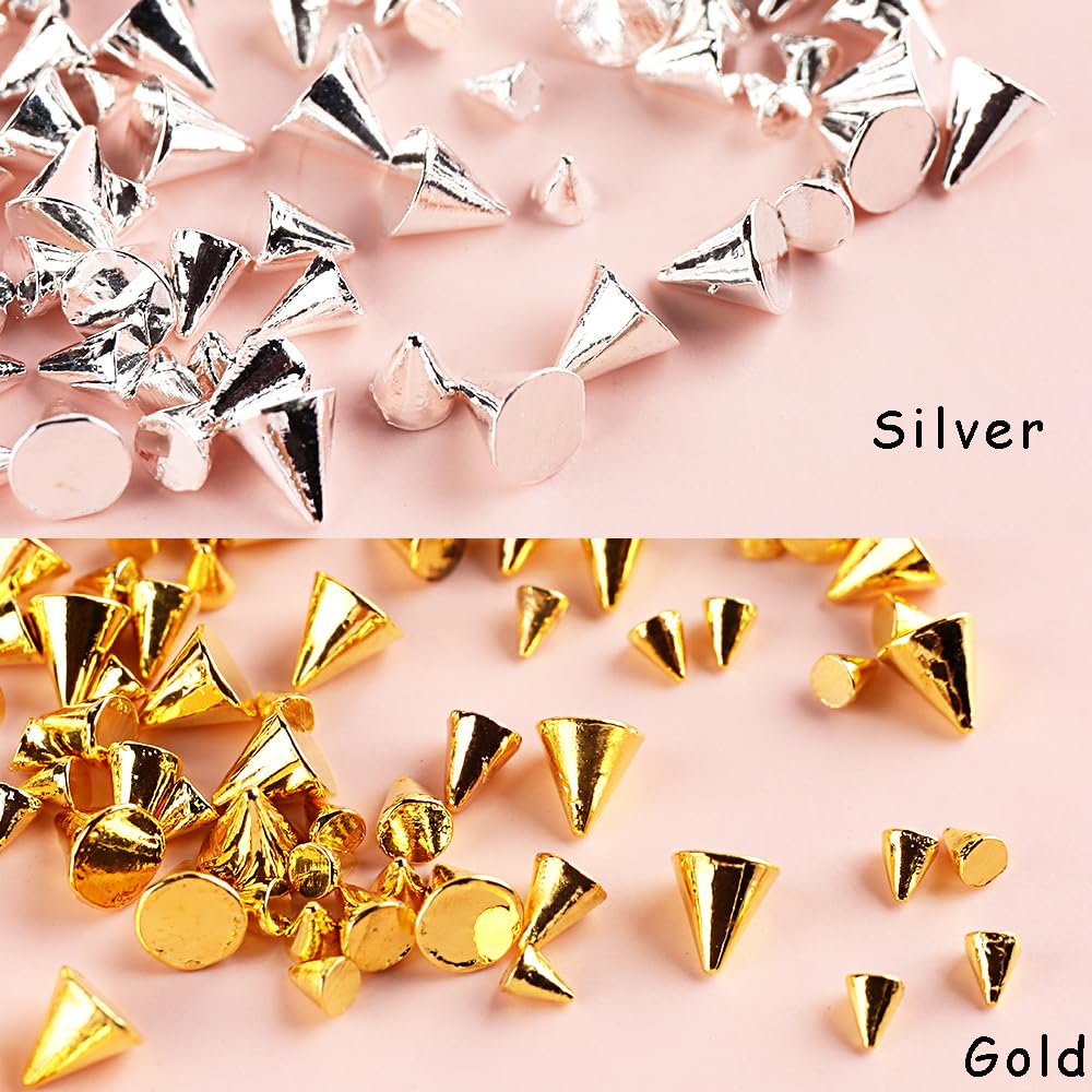Close up view of gold and silver alloy spike studs flatback nail jewels on long acrylic nails decoration
