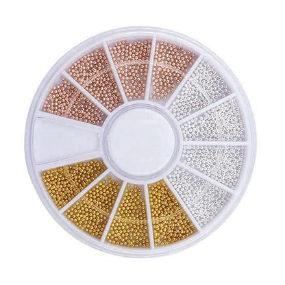 Professional 3D caviar manicure showcasing intricate patterns made with mini gold steel beads on premium extensions.