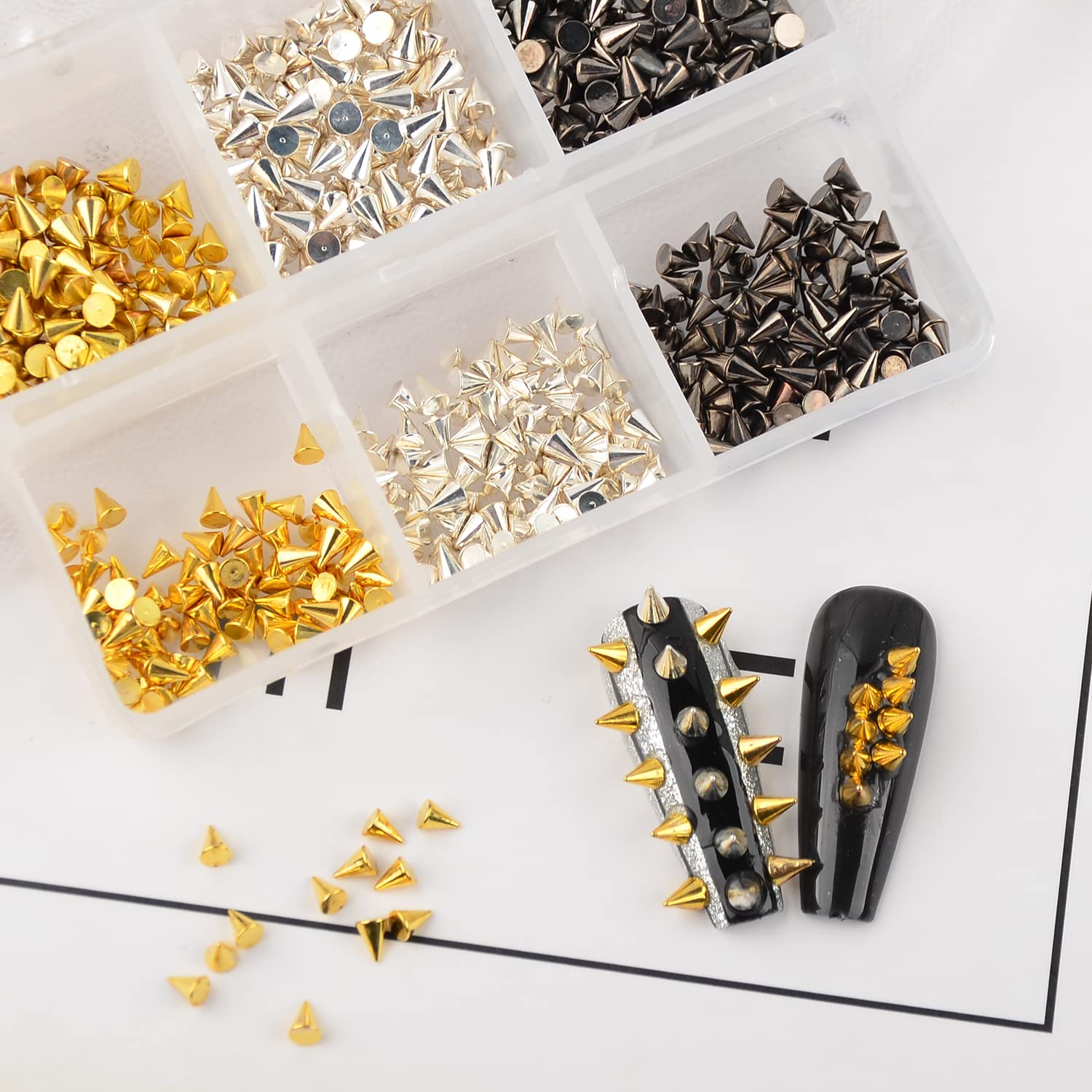 Edgy rock inspired nail art layout utilizing various sizes of metallic spike studs