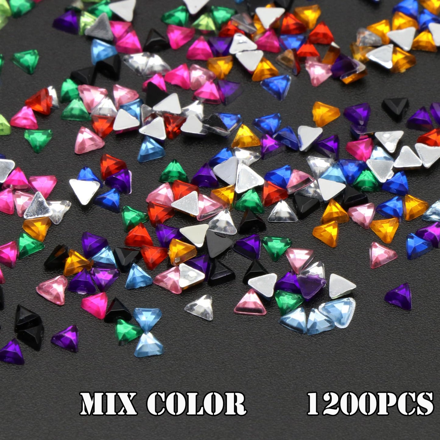 Assorted small metal rivets in gold and silver shades for alternative salon manicures.