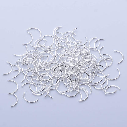 BAIYIYI alloy metal charms being applied onto polished artificial nails with glue