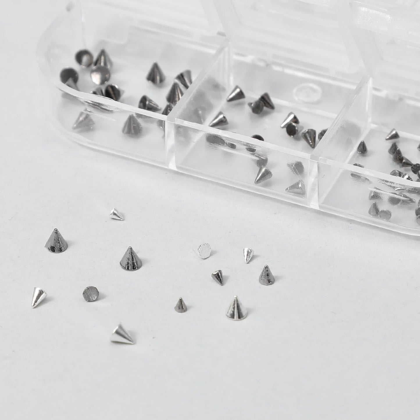 Examples of 3D punk nail art using Teaaha metal charms