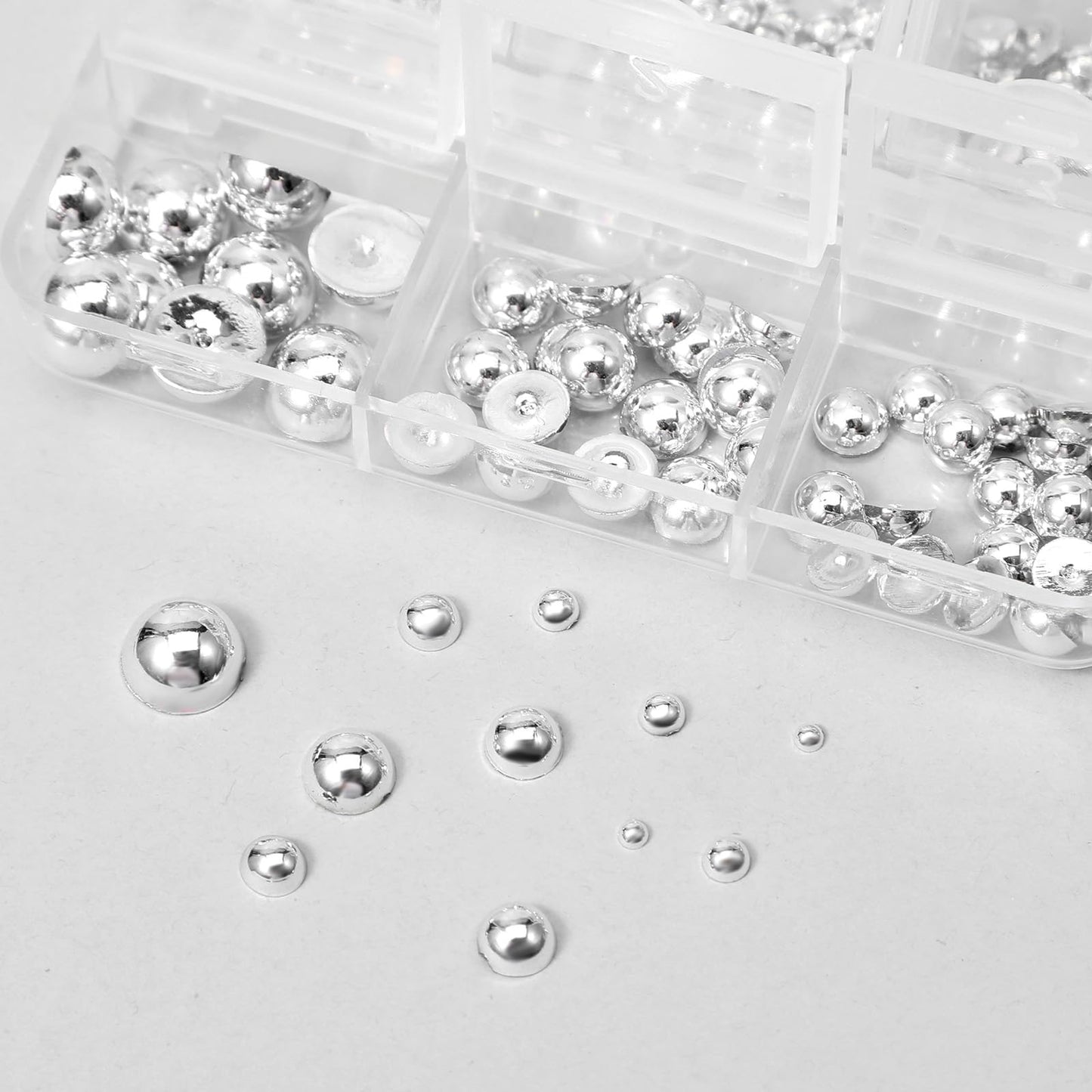 Assorted metallic steel balls and spikes in Teaaha kit