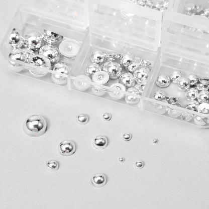 Assorted metallic steel balls and spikes in Teaaha kit