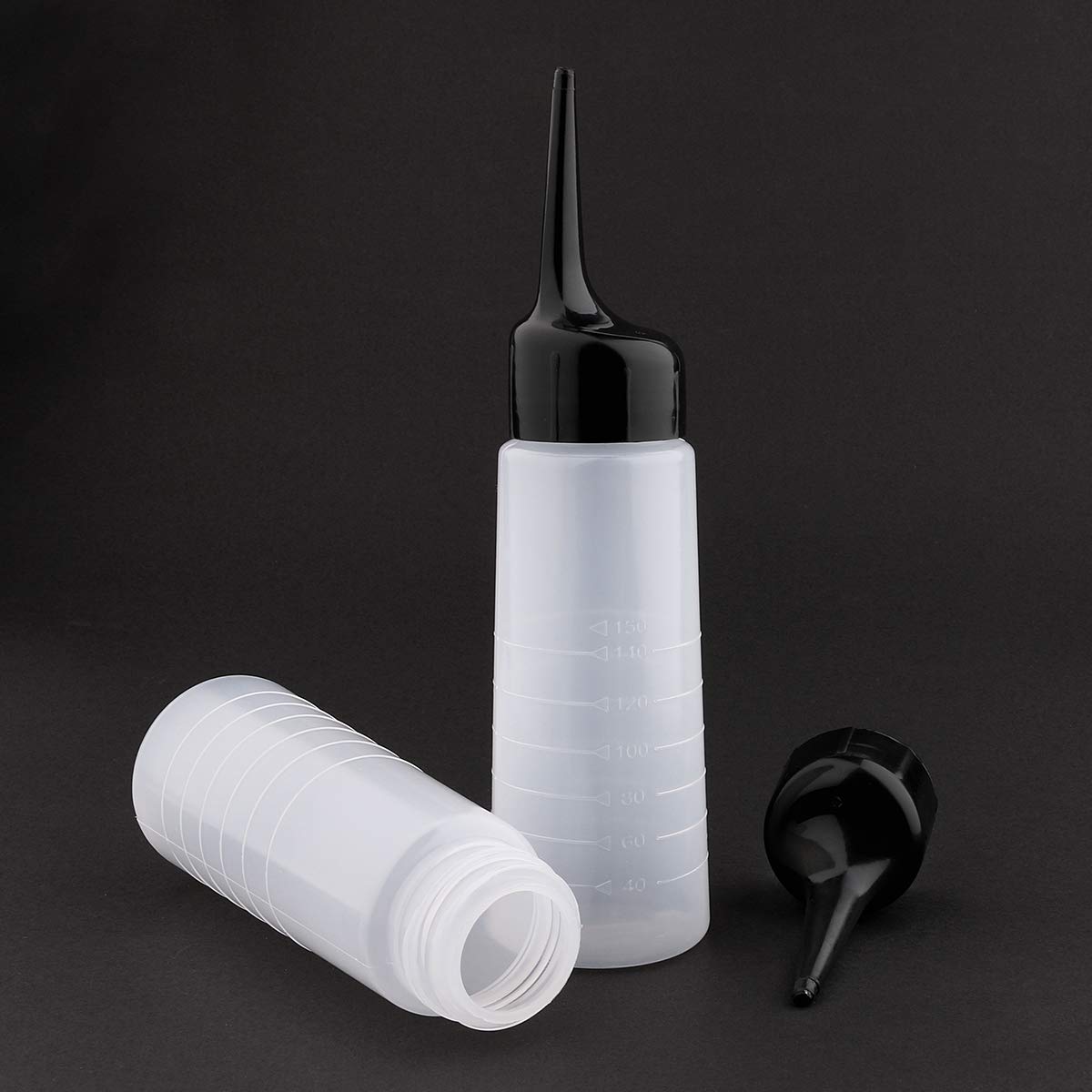 Close up view of the black slanted tip nozzle on the Yebeauty hair color bottle