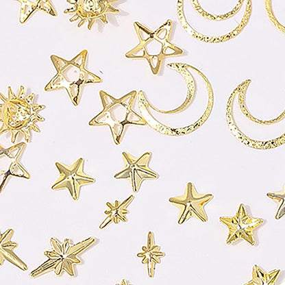 Creative DIY display showing the celestial nail jewels used on a decorated phone case and nail extensions.