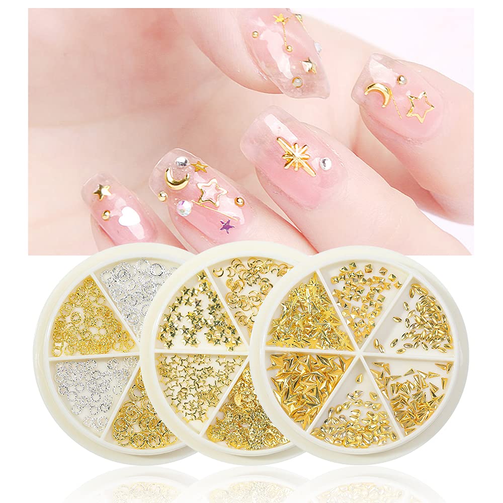 HNUIX miniature star moon and ring manicure studs neatly arranged in a clear three compartment storage container