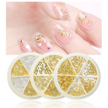 HNUIX miniature star moon and ring manicure studs neatly arranged in a clear three compartment storage container