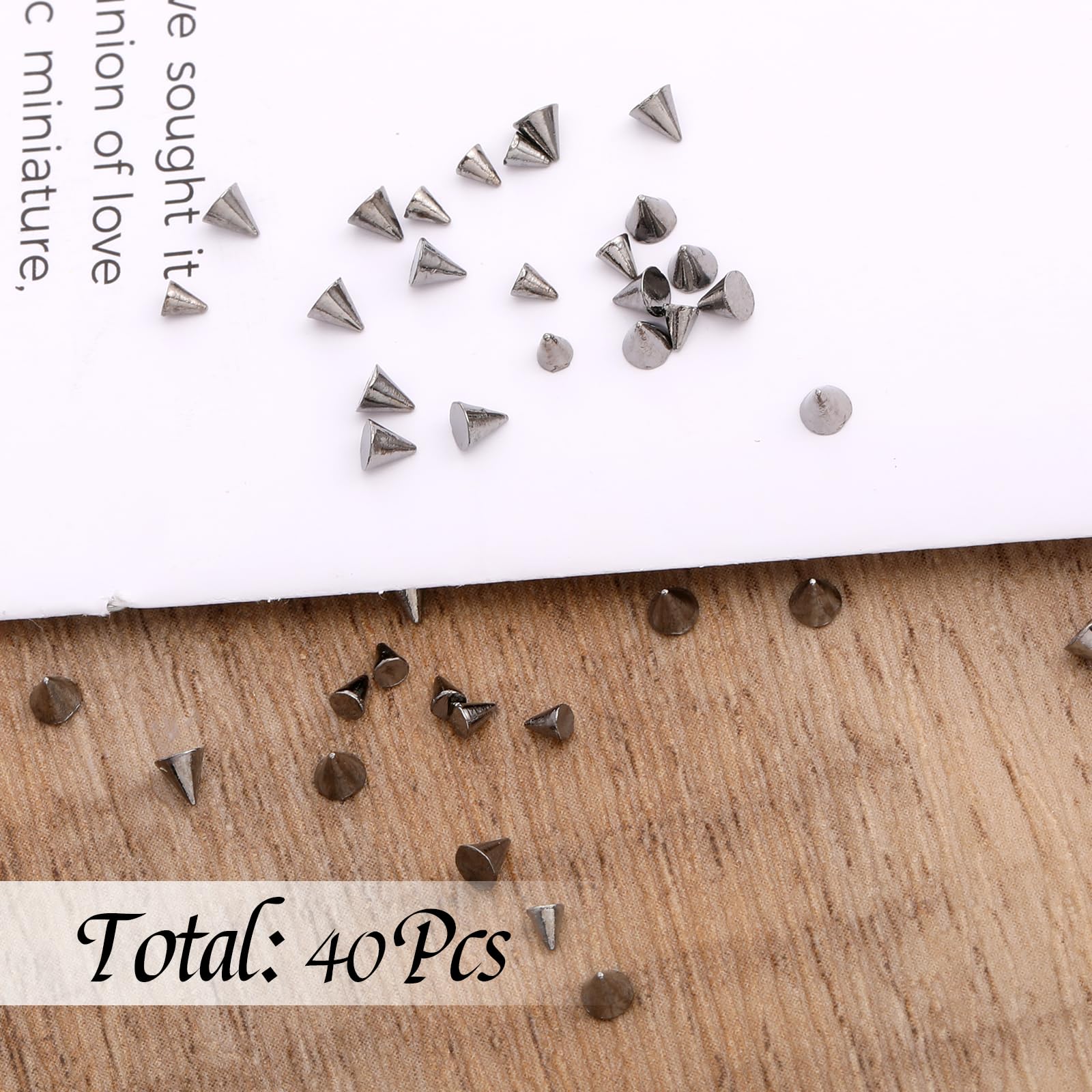 Variety of mixed size metal nail charms in organizer box