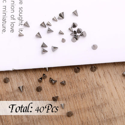 Variety of mixed size metal nail charms in organizer box