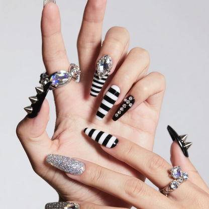 Application of punk metal studs on professional manicure
