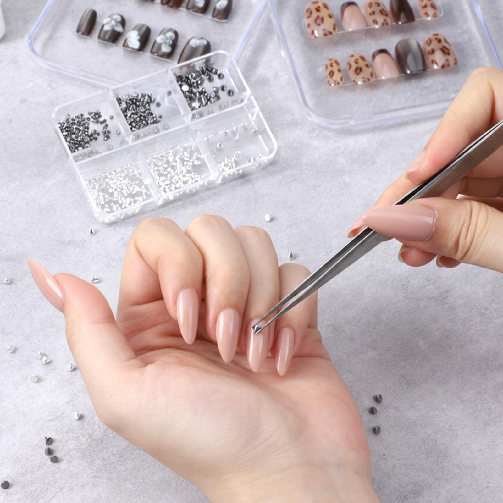 Silver and black alloy nail studs in various geometric shapes