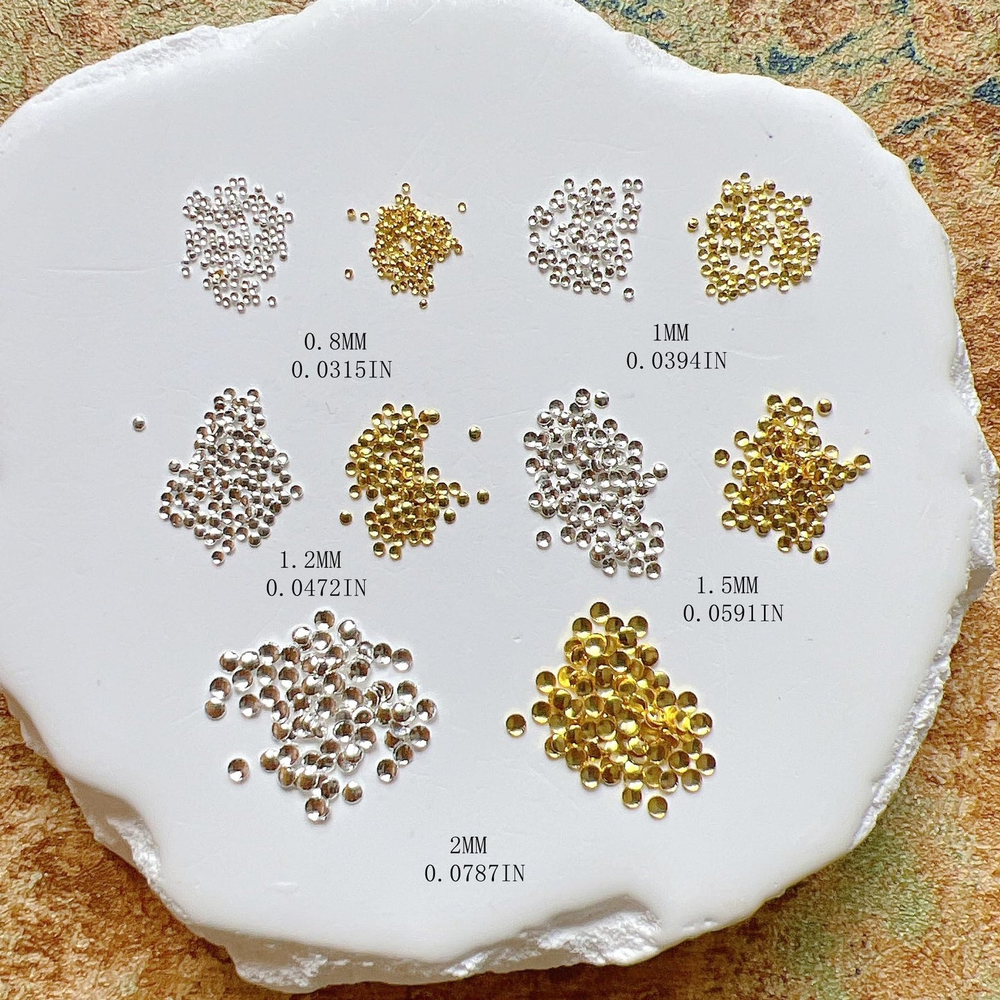 Nail Angel metallic product assortment showing the high shine finish of gold and silver salon supplies.