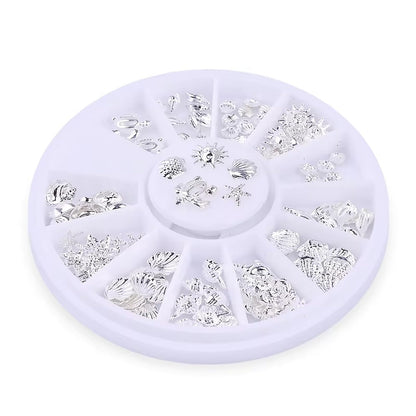 Premium silver metallic 3D nail art embellishments featuring realistic ocean shells and starfish shapes.
