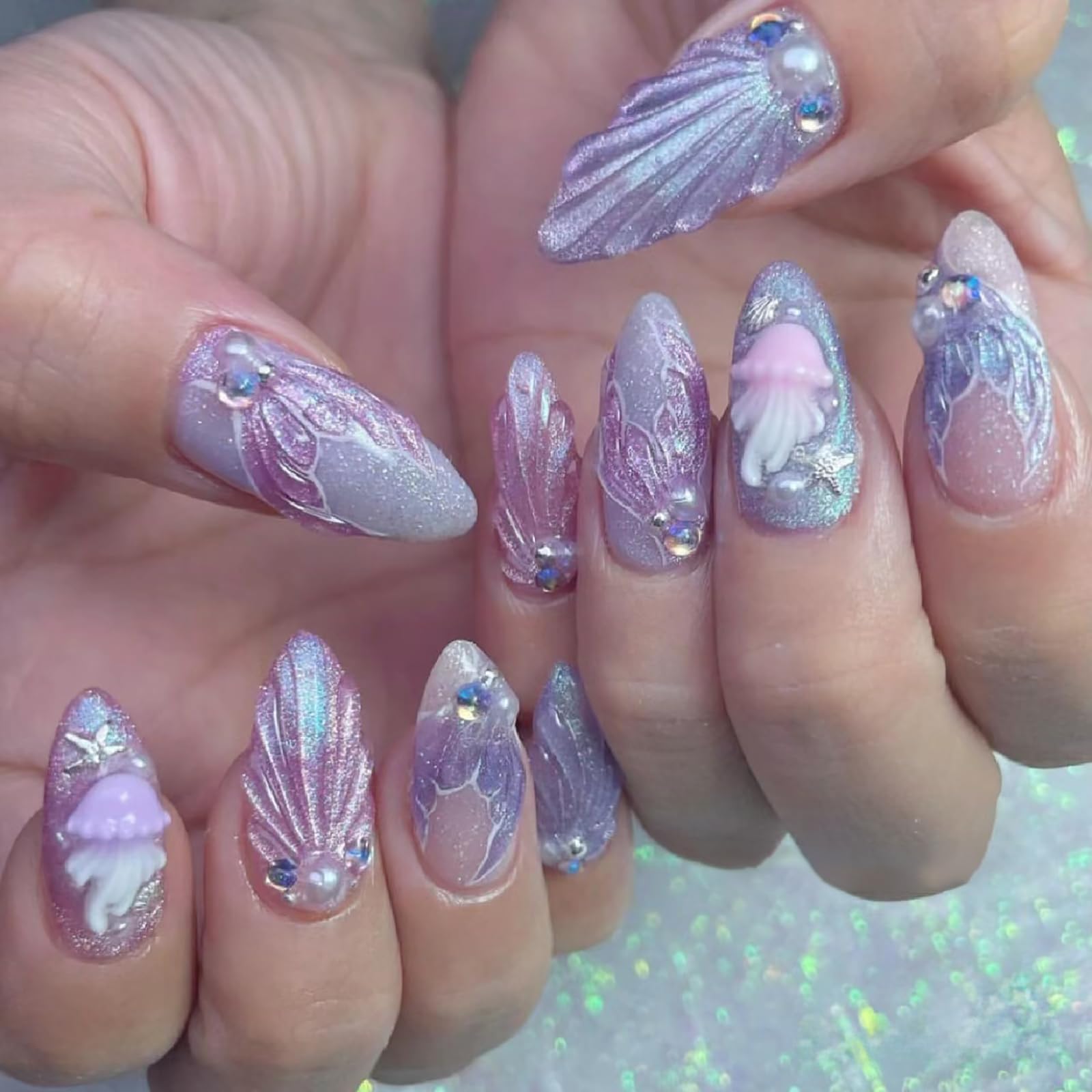 Detailed look at the twelve unique coastal patterns within the ONEUPIN silver nail art kit.