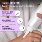 Close up of the black twist open and close nozzle on the empty plastic squeeze bottle