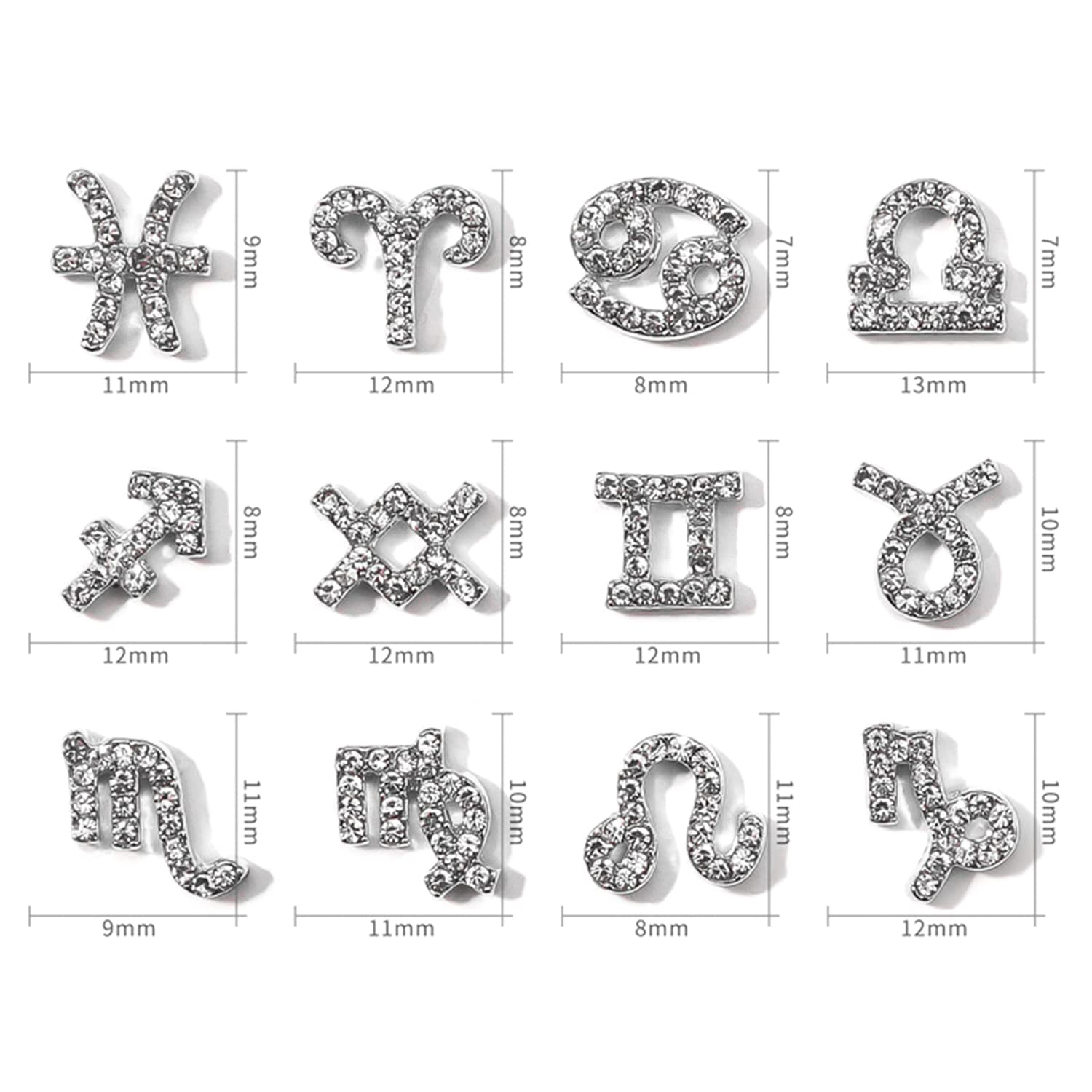 Close up view of gold and silver alloy zodiac nail charms showing embedded rhinestones and detailed constellation words.