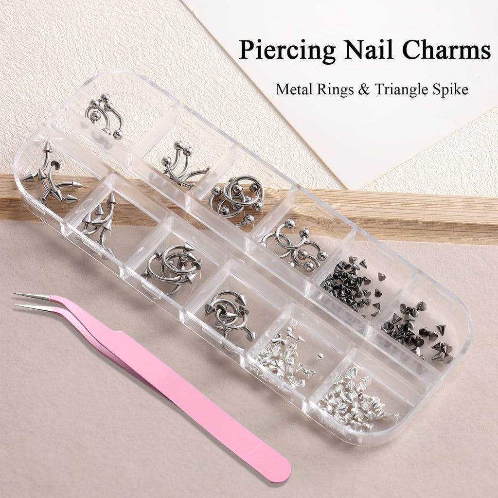 Close-up of silver alloy goth punk nail piercing rings and captive beads