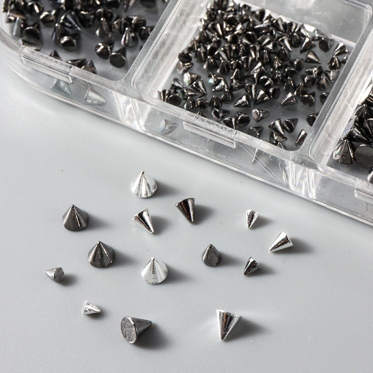Precision pickup tweezers included in nail art kit