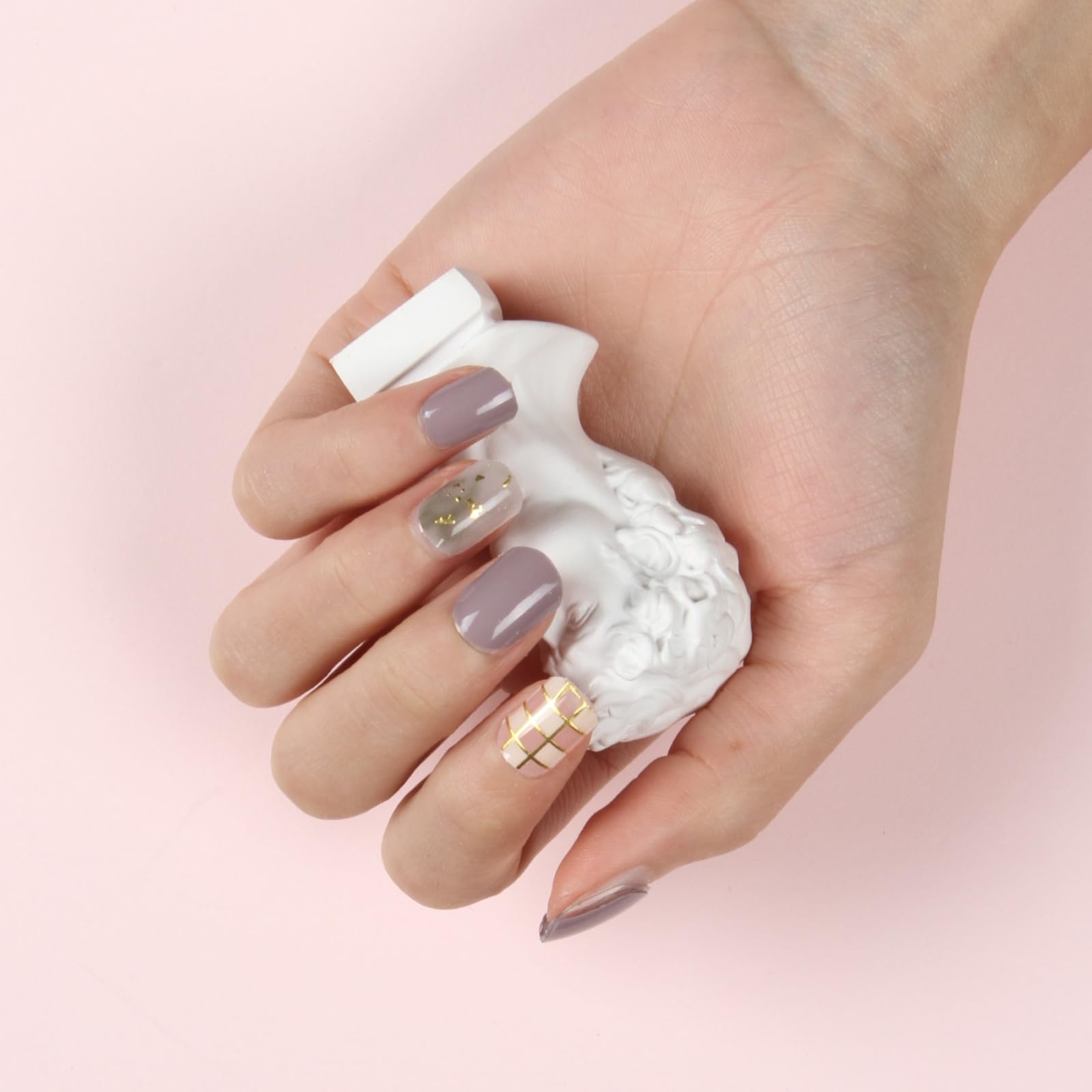 Top down view of 34 piece gel nail strip set in various sizes