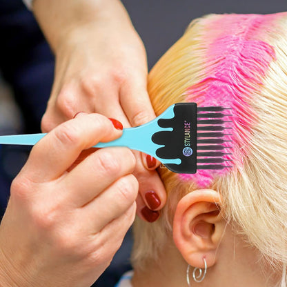 Professional hair stylist using color brush for balayage