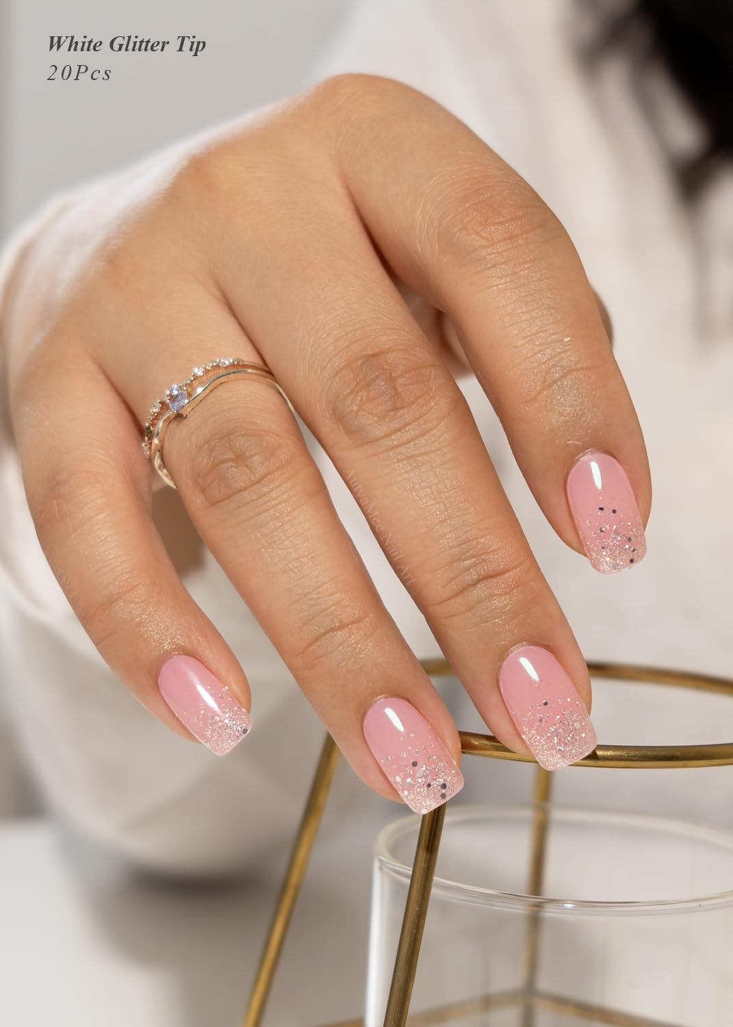 Pink base gel nail wraps with glitter tips in packaging