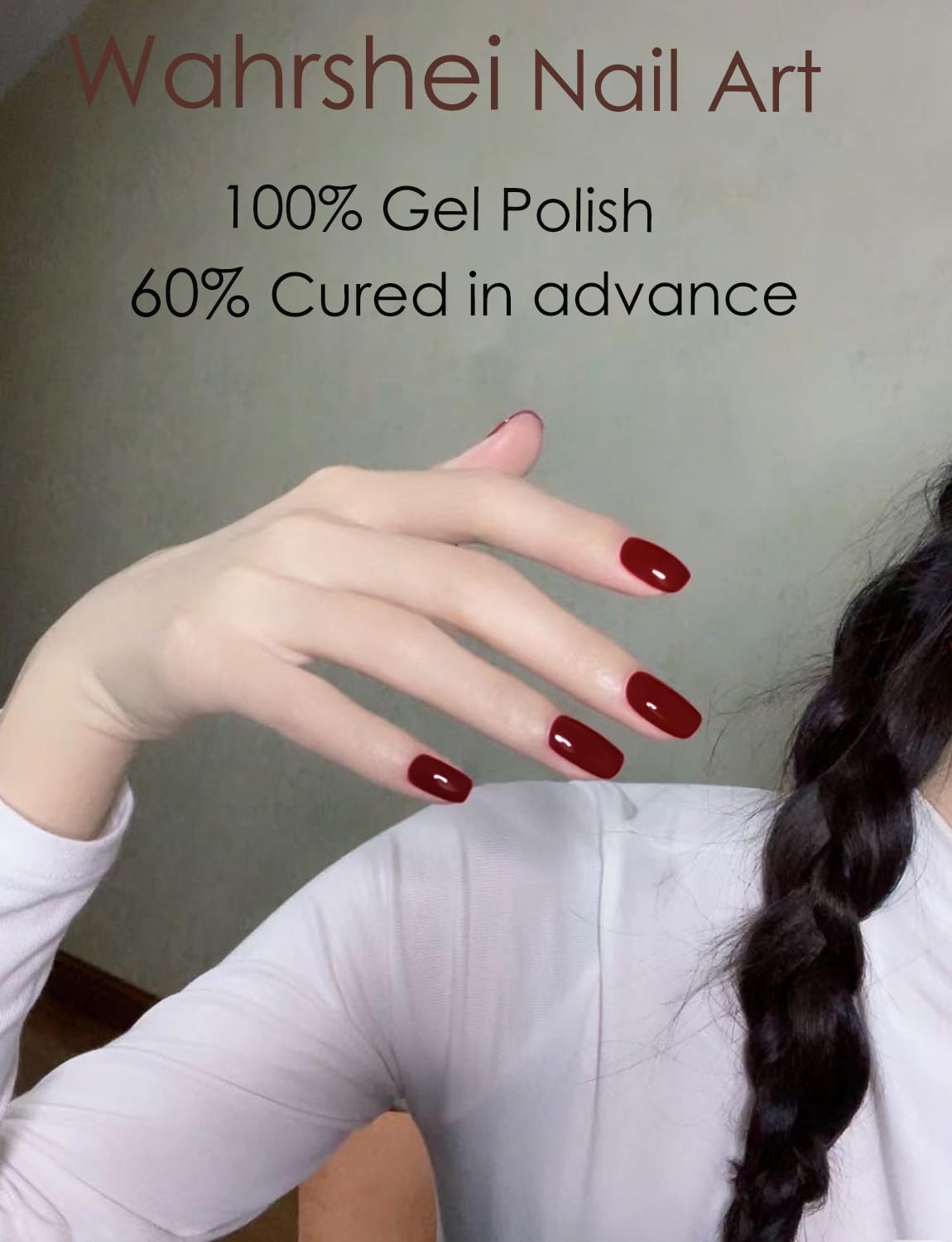 Hands displaying salon quality manicure with wine red nail strips