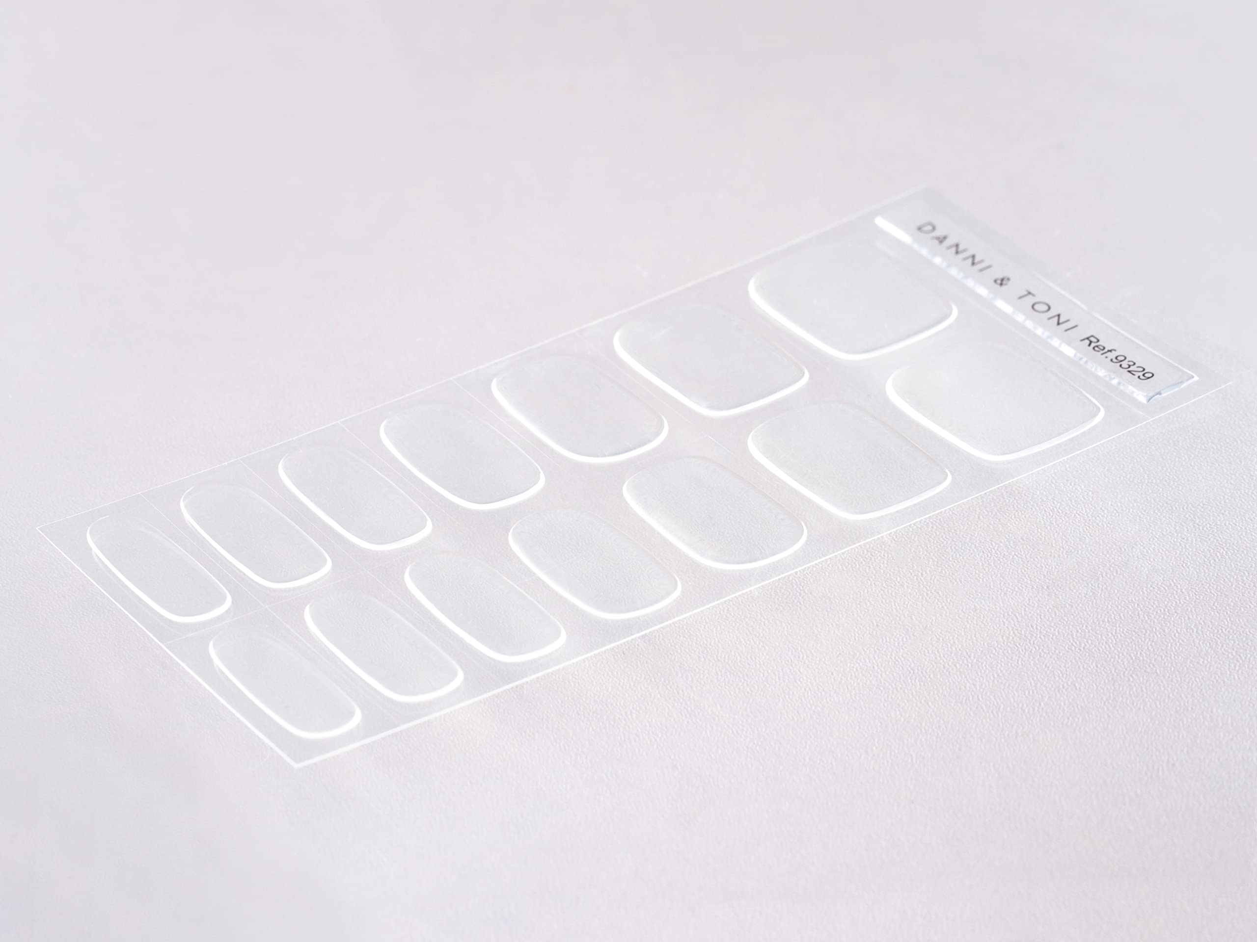 Close up of crystal clear gel nail strips on fingernails