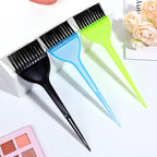 Three Aternal hair coloring brushes displayed on a salon workstation