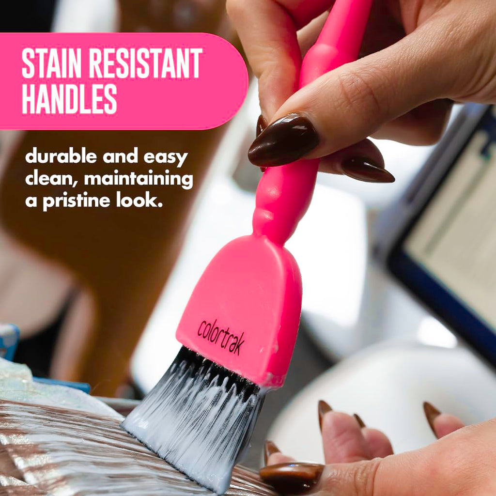Professional stylist holding Colortrak electric hair color brush
